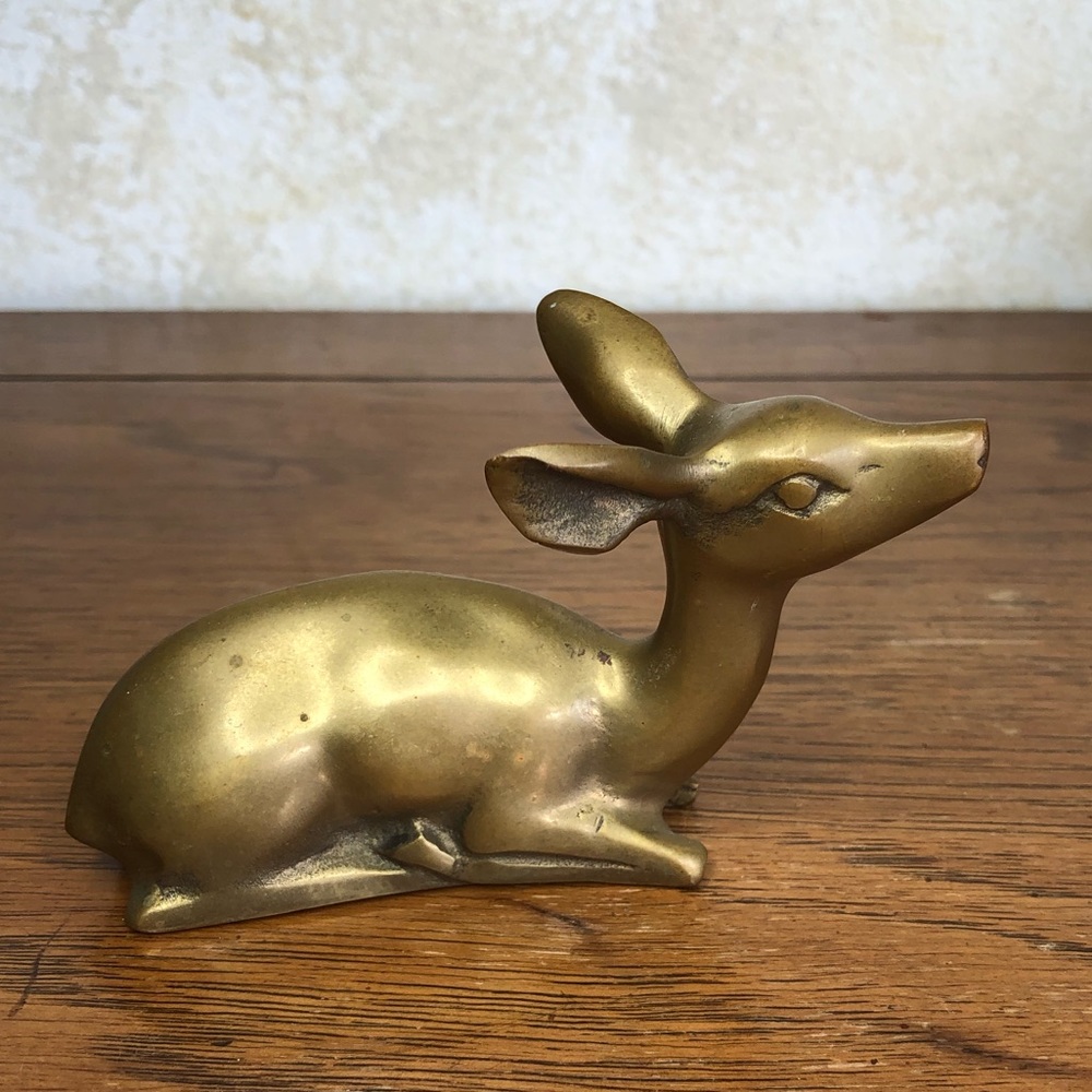 Vintage brass laying down doe deer figure